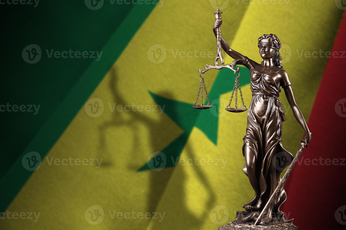 Senegal flag with statue of lady justice and judicial scales in dark room. Concept of judgement and punishment photo