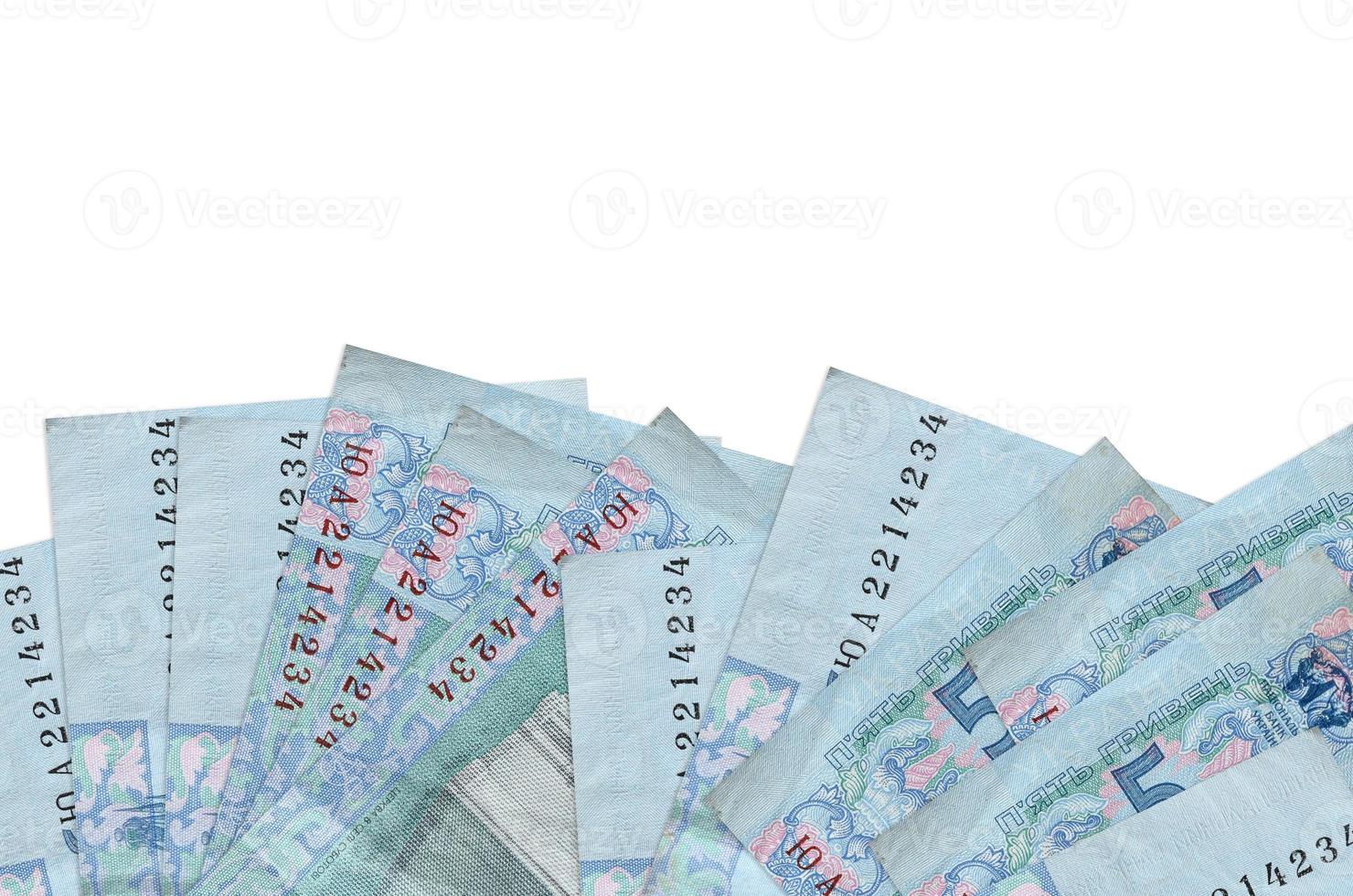 5 Ukrainian hryvnias bills lies on bottom side of screen isolated on white background with copy space. Background banner template photo