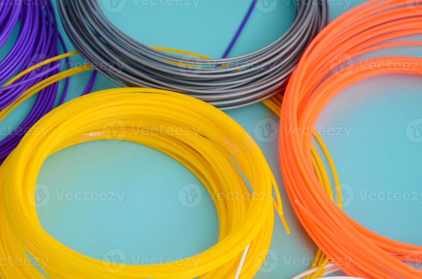 Plastic PLA and ABS filament material for printing on a 3D pen or printer of various colors photo