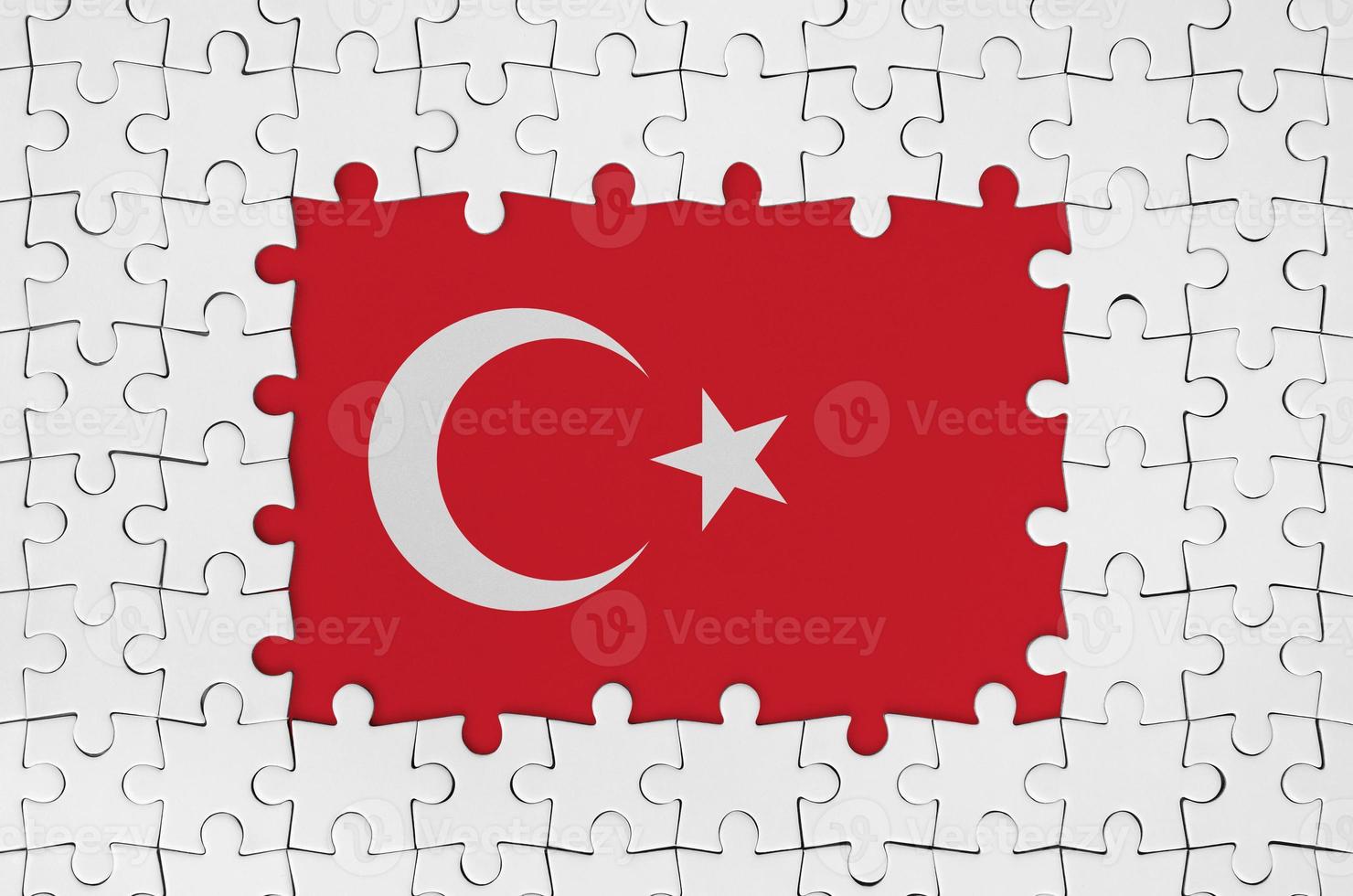 Turkey flag in frame of white puzzle pieces with missing central part photo