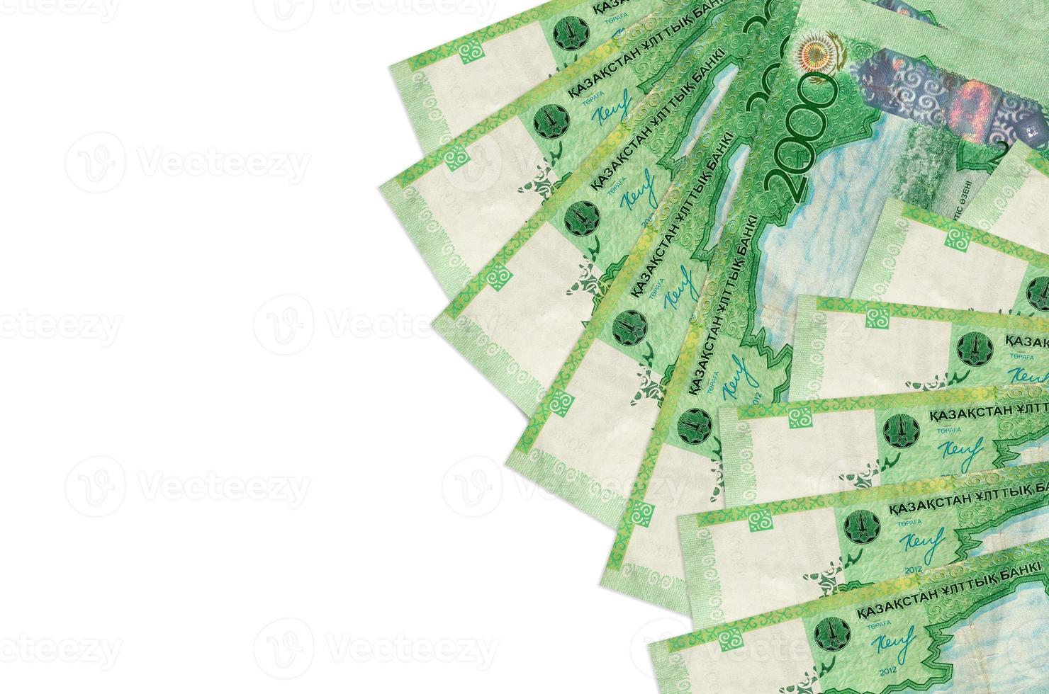 2000 Kazakhstani tenge bills lies isolated on white background with copy space. Rich life conceptual background photo