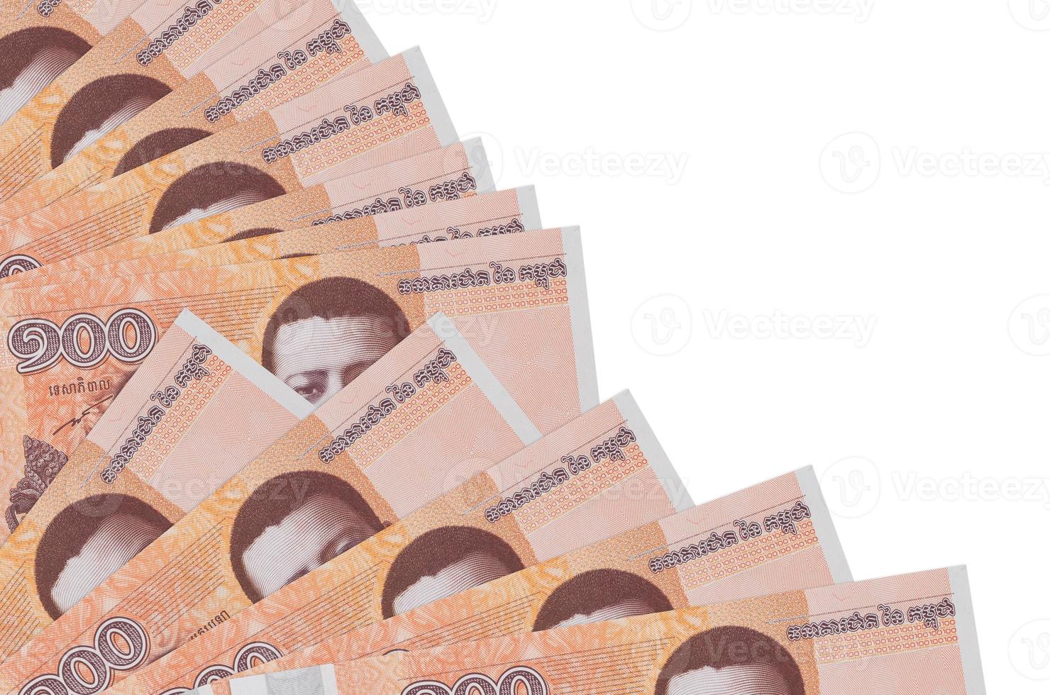 100 Cambodian riels bills lies isolated on white background with copy space stacked in fan close up photo