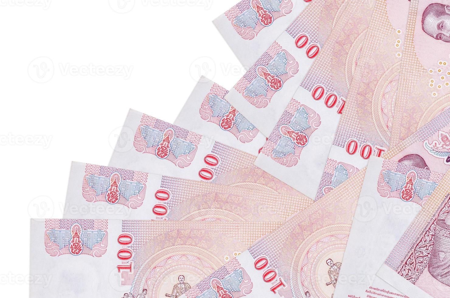 100 Thai Baht bills lies in different order isolated on white. Local banking or money making concept photo