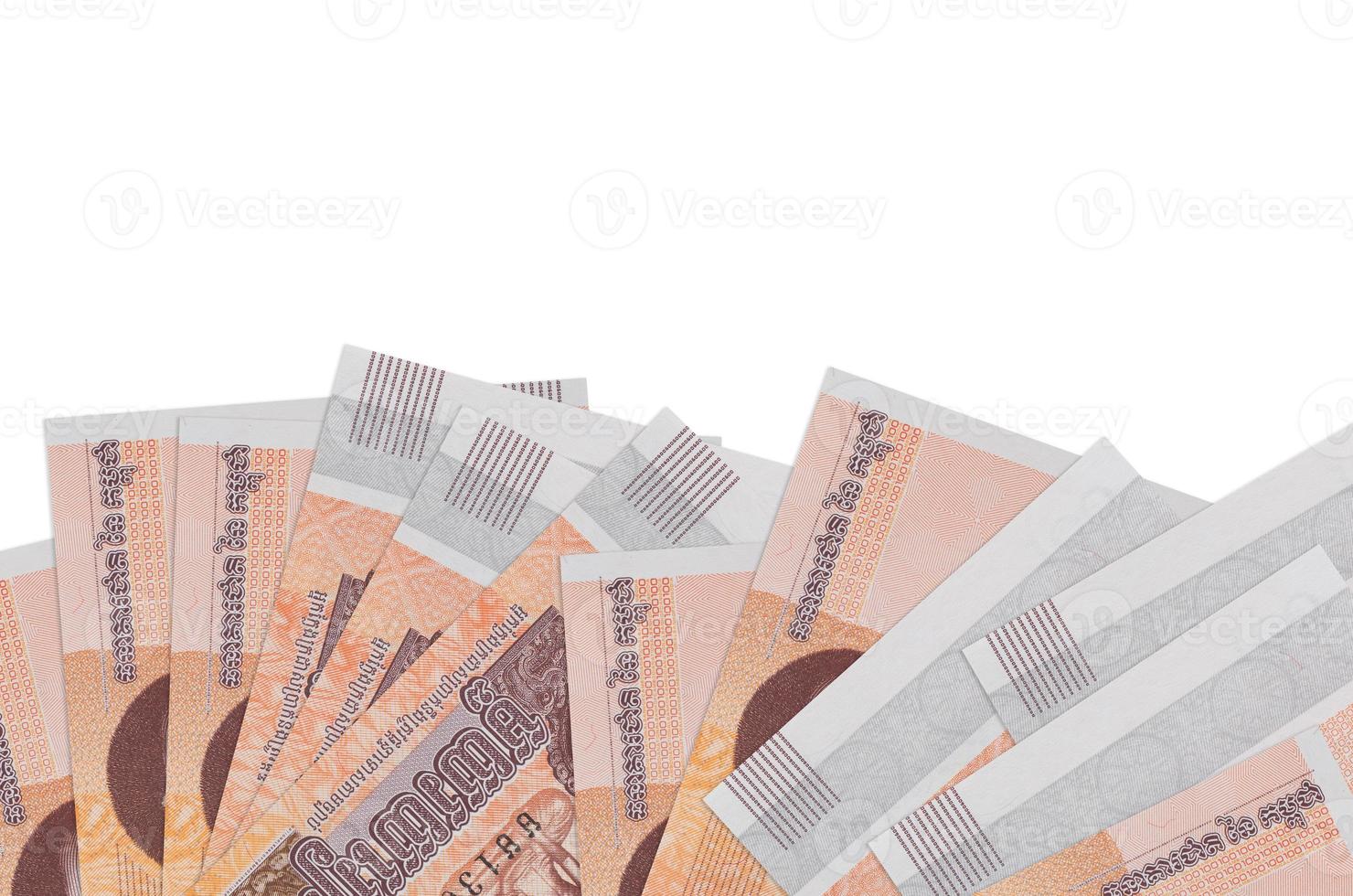 100 Cambodian riels bills lies on bottom side of screen isolated on white background with copy space. Background banner template photo