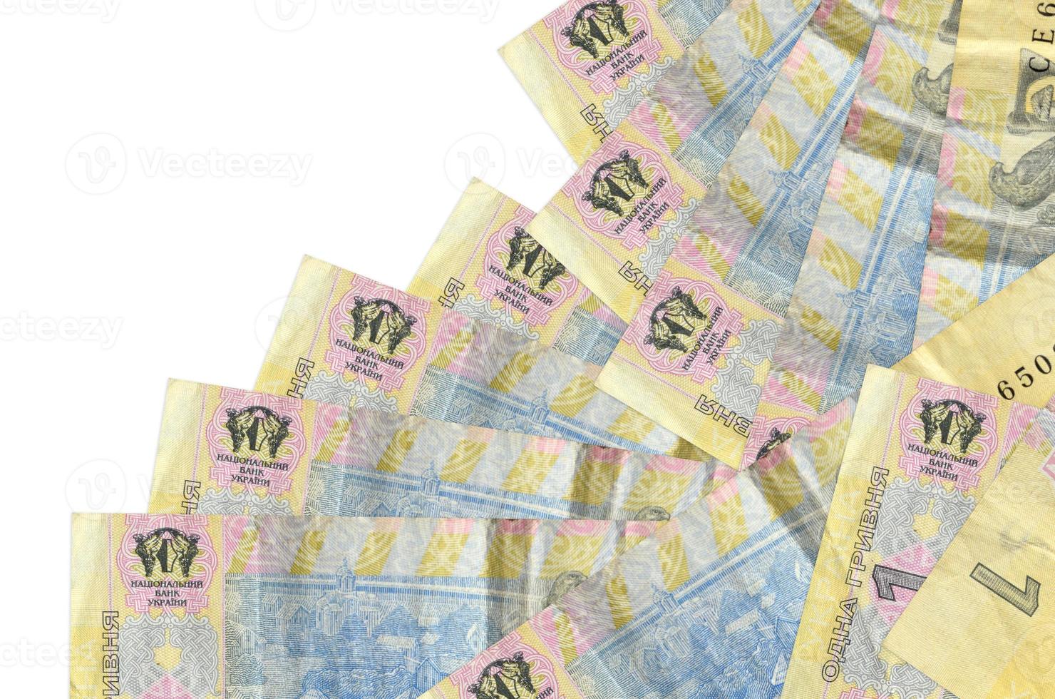 1 Ukrainian hryvnia bills lies in different order isolated on white. Local banking or money making concept photo