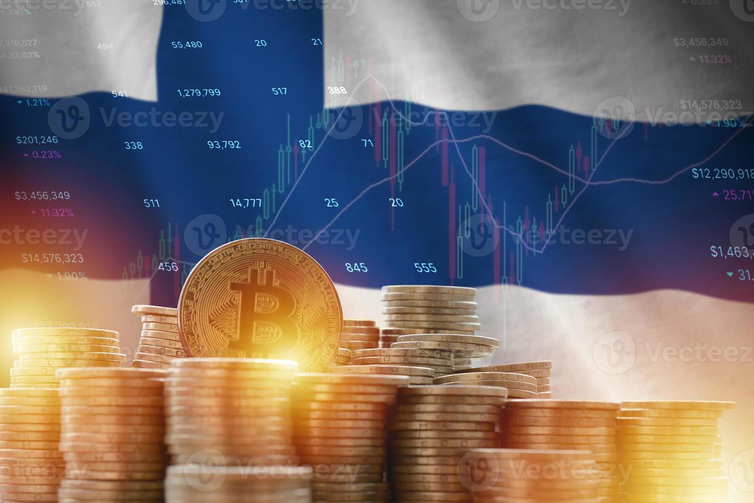 Finland flag and big amount of golden bitcoin coins and trading platform chart. Crypto currency photo