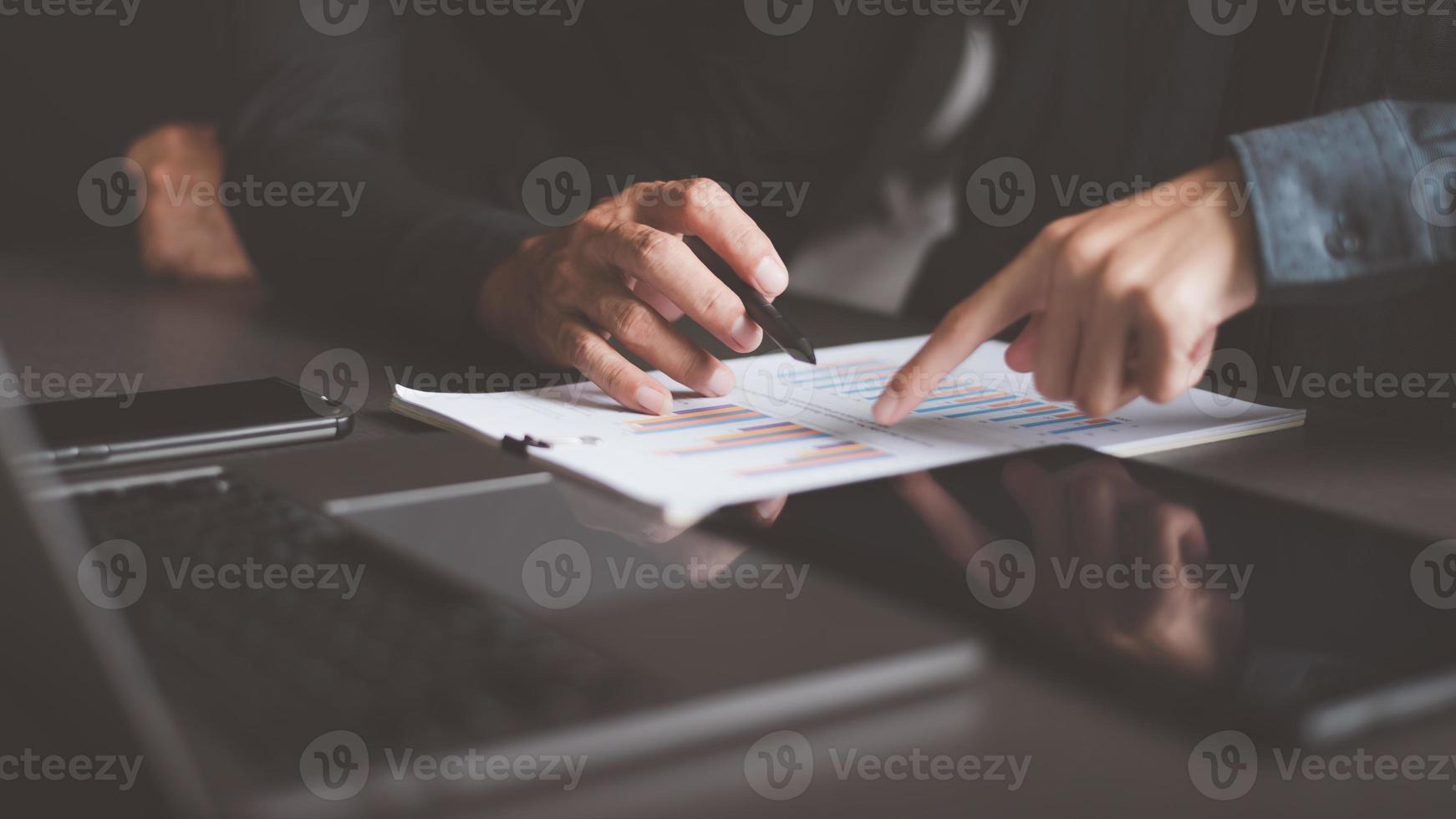 Businessman analyzing business growth graph,industry development achievements,effective investment trends,growth targets and increasing profits of organization,data gathering and statistical working. photo
