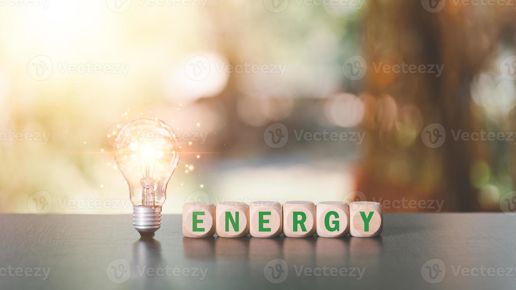 protecting the environment alternative energy Sustainable renewable energy sources Green energy innovation and environmentally friendly energy technology,Light bulbs and wooden blocks on the table photo
