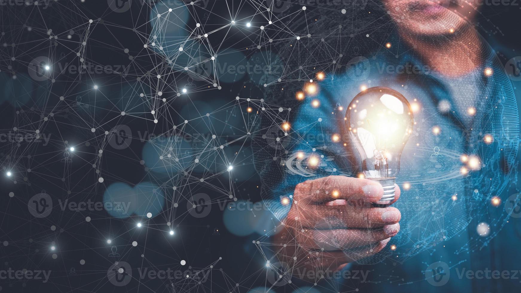 man holding light bulb,modern cyberspace network technology concept,to communicate and connect information through a global society,innovative and scientific ideas,working through high speed internet photo