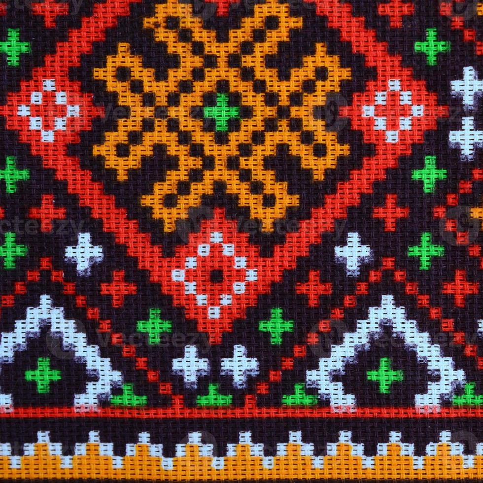 Traditional Ukrainian folk art knitted embroidery pattern on textile fabric photo