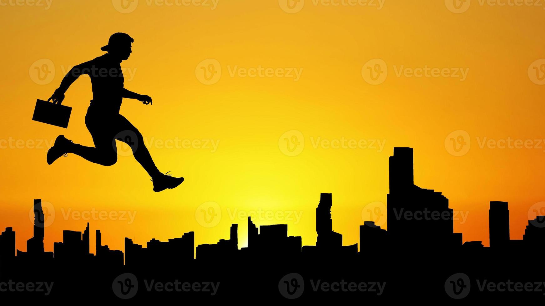 Silhouette of a man jumping in the meadow. The business man concept moves forward in the future. photo