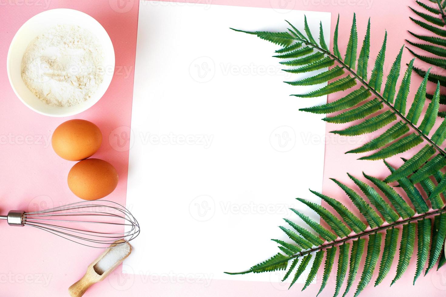 Ingredients for cooking baking - flour, egg, sugar, rolling pin on pink background. Concept of cooking dessert. photo