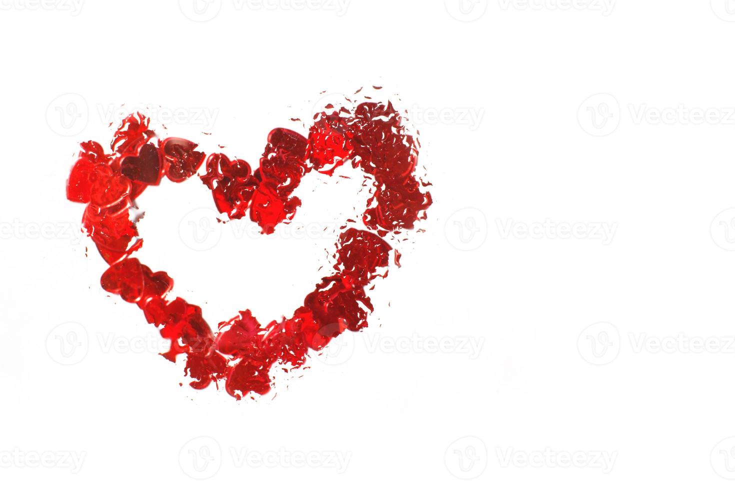 Red heart under glass surface with water drops close. Valentines background, love, date concept photo