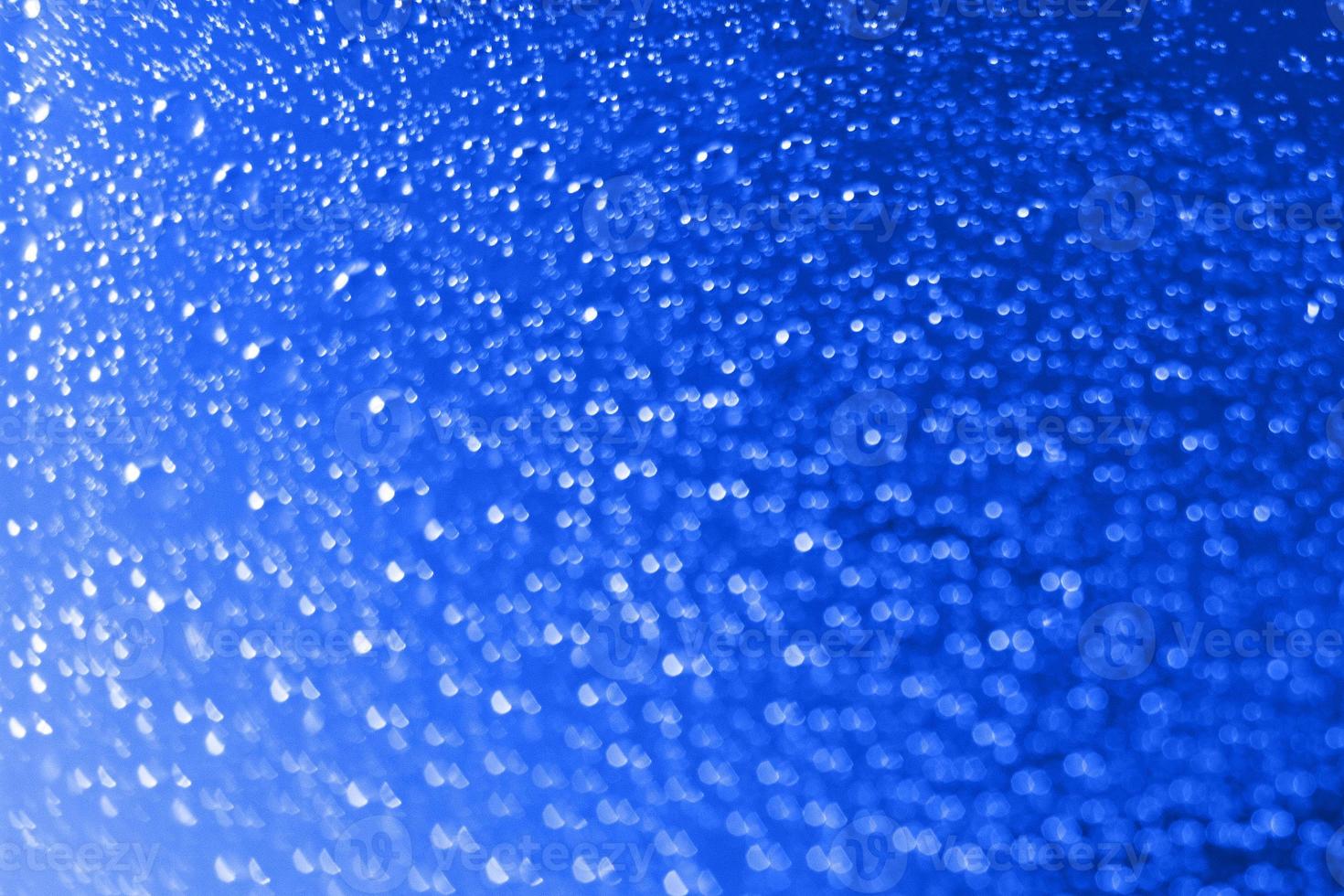 abstract red background with bokeh and  drops of water photo