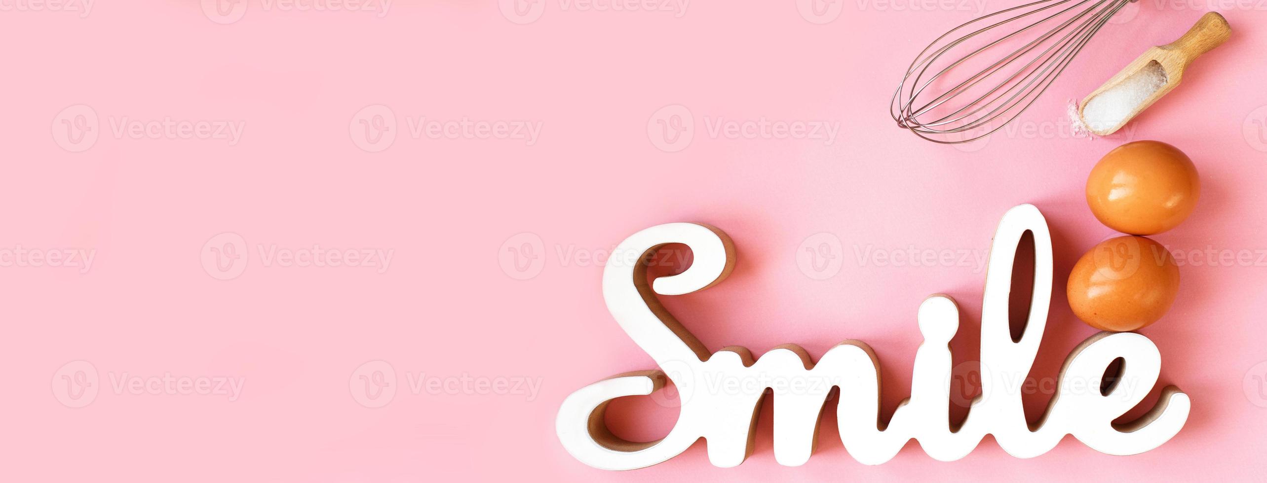 Ingredients for cooking baking - egg, sugar, rolling pin on pink background. Concept of cooking dessert. banner photo