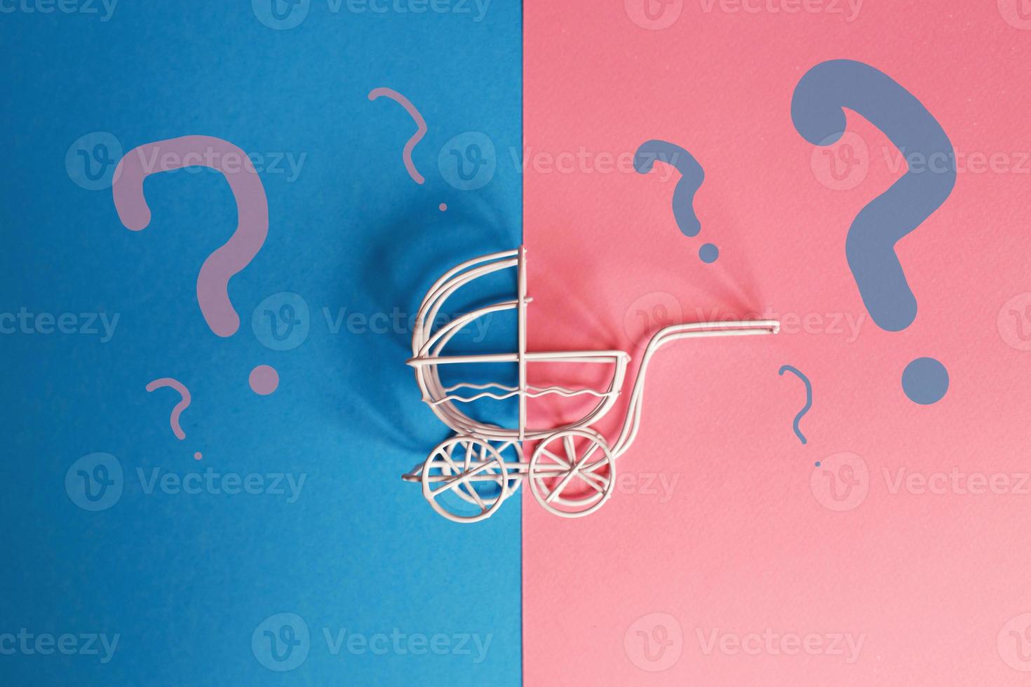 vintage baby stroller on pink and blue background. Boy or girl question photo