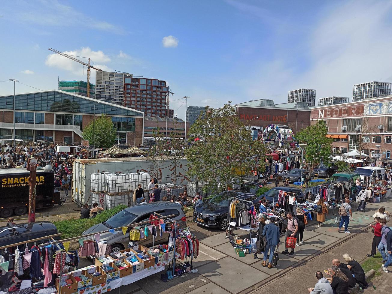 Amsterdam, Netherlands, 2022 - Unidentified people at IJ-Hallen flea market in Amsterdam, The Netherlands. It is the biggest and most unique flea market in Europe. photo