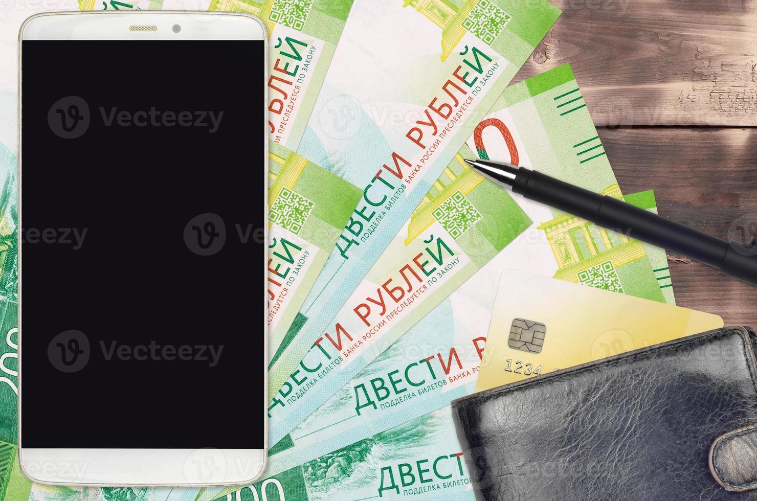 200 russian rubles bills and smartphone with purse and credit card. E-payments or e-commerce concept. Online shopping and business with portable devices photo