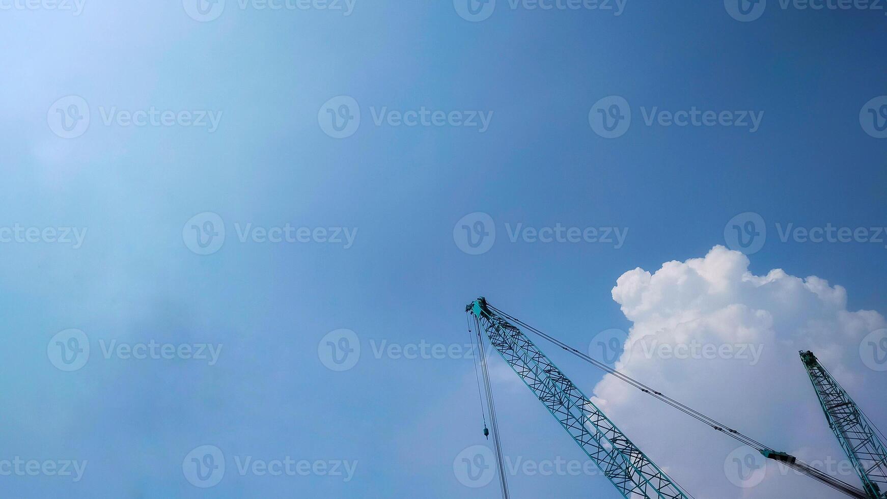 Top boom of crawler crane rise to the sky, for background. photo