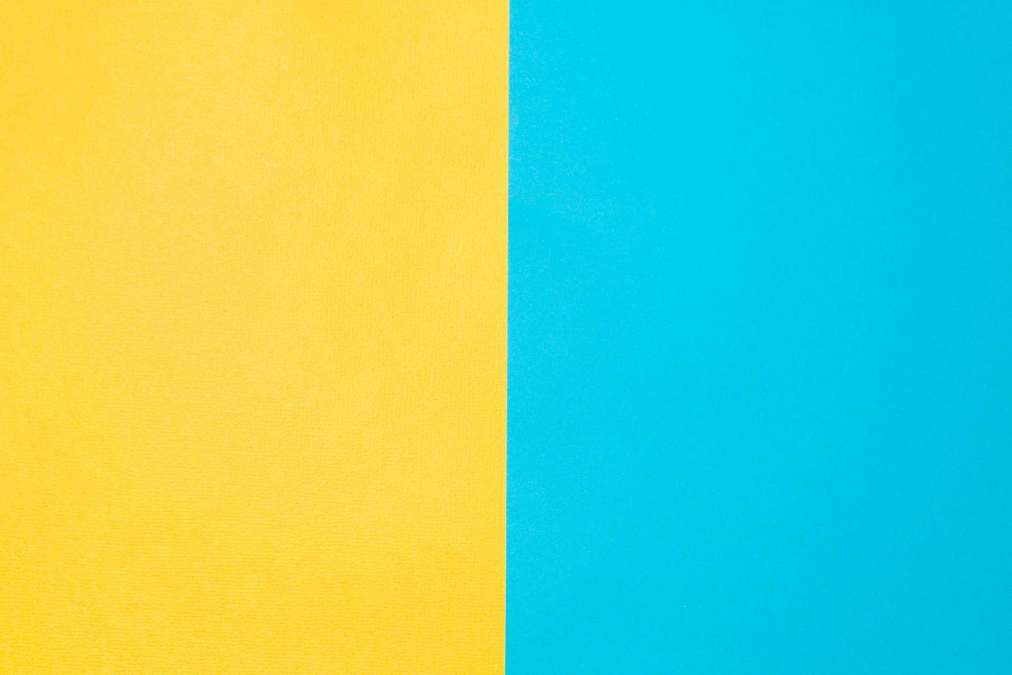 Top view texture paper background. Yellow-blue colored backdrop. Two vertical backgrounds photo