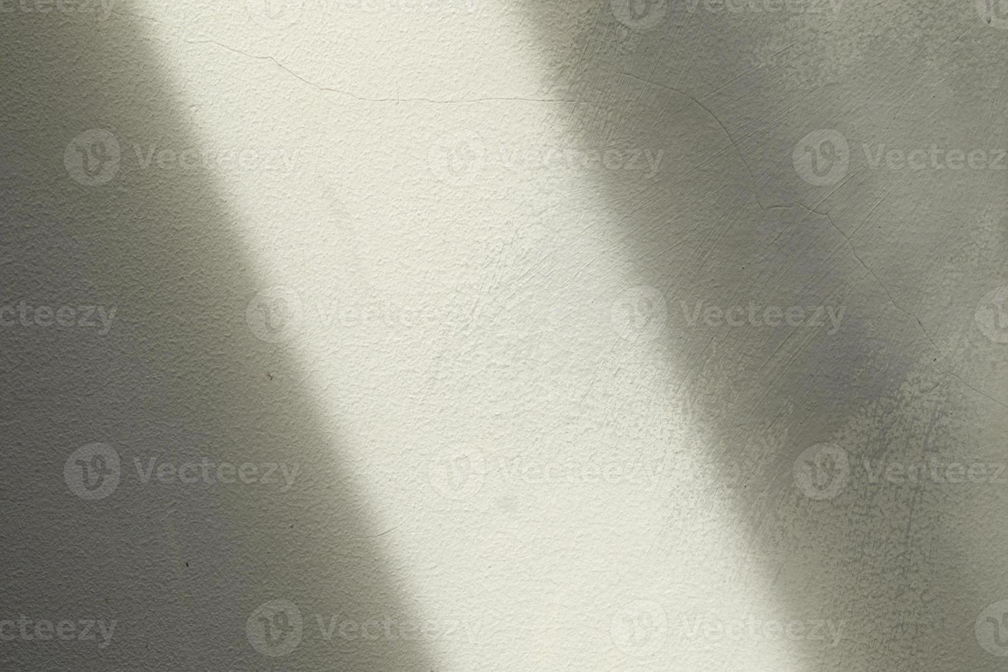 gray wall with scratch and sun rays. good for background photo