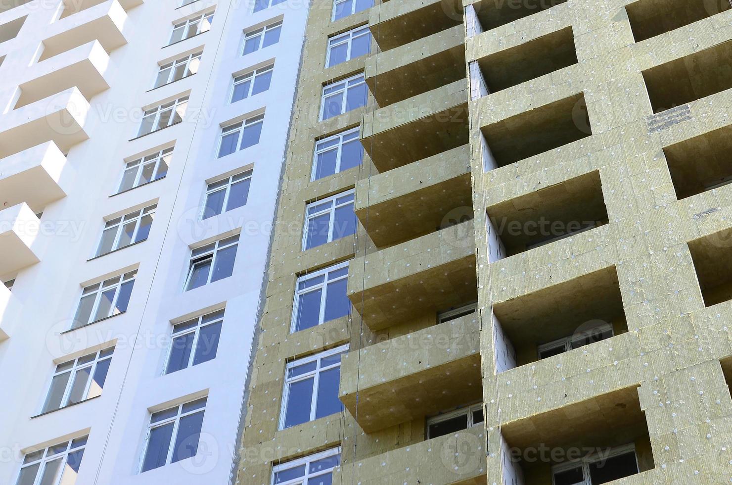 Residential multi store apartement building house facade under construction photo