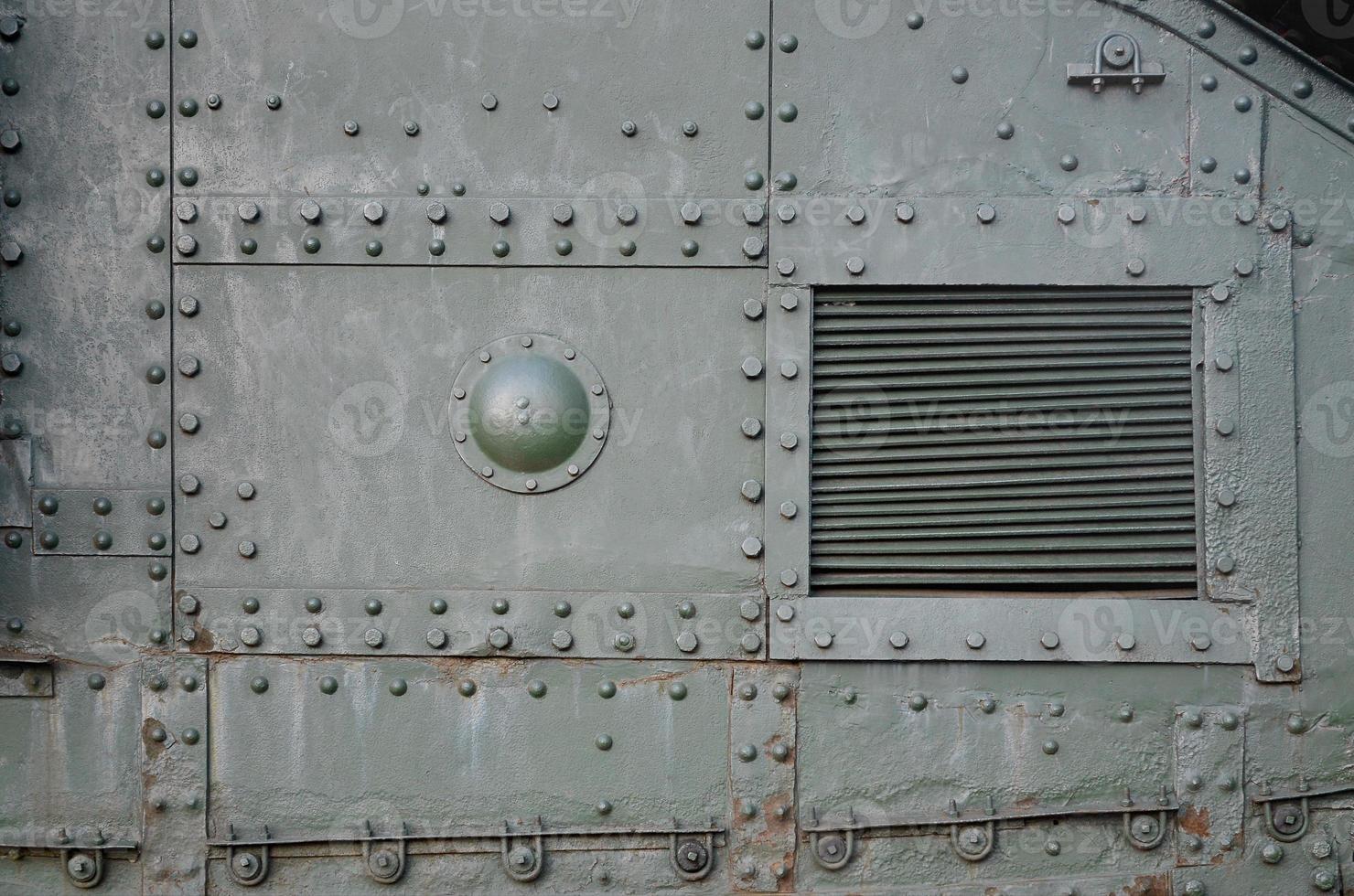 Abstract green industrial metal textured background with rivets and bolts photo