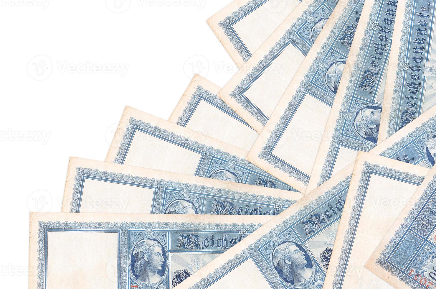 100 Reich marks bills lies in different order isolated on white. Local banking or money making concept photo