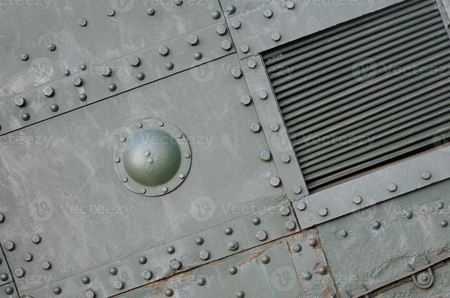 Abstract green industrial metal textured background with rivets and bolts photo