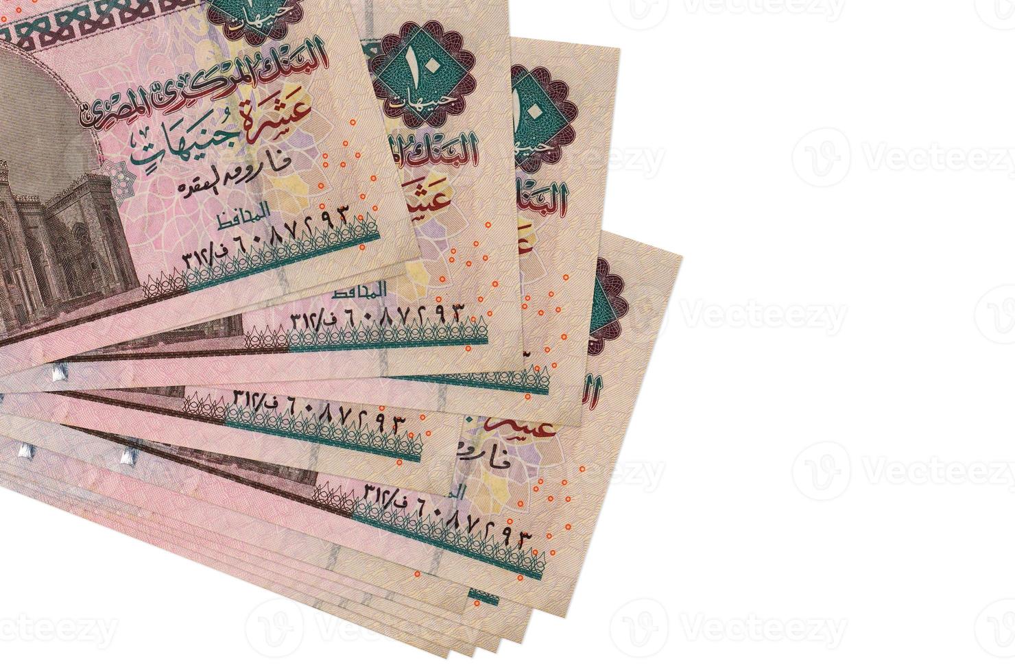 10 Egyptian pounds bills lies in small bunch or pack isolated on white. Mockup with copy space. Business and currency exchange photo