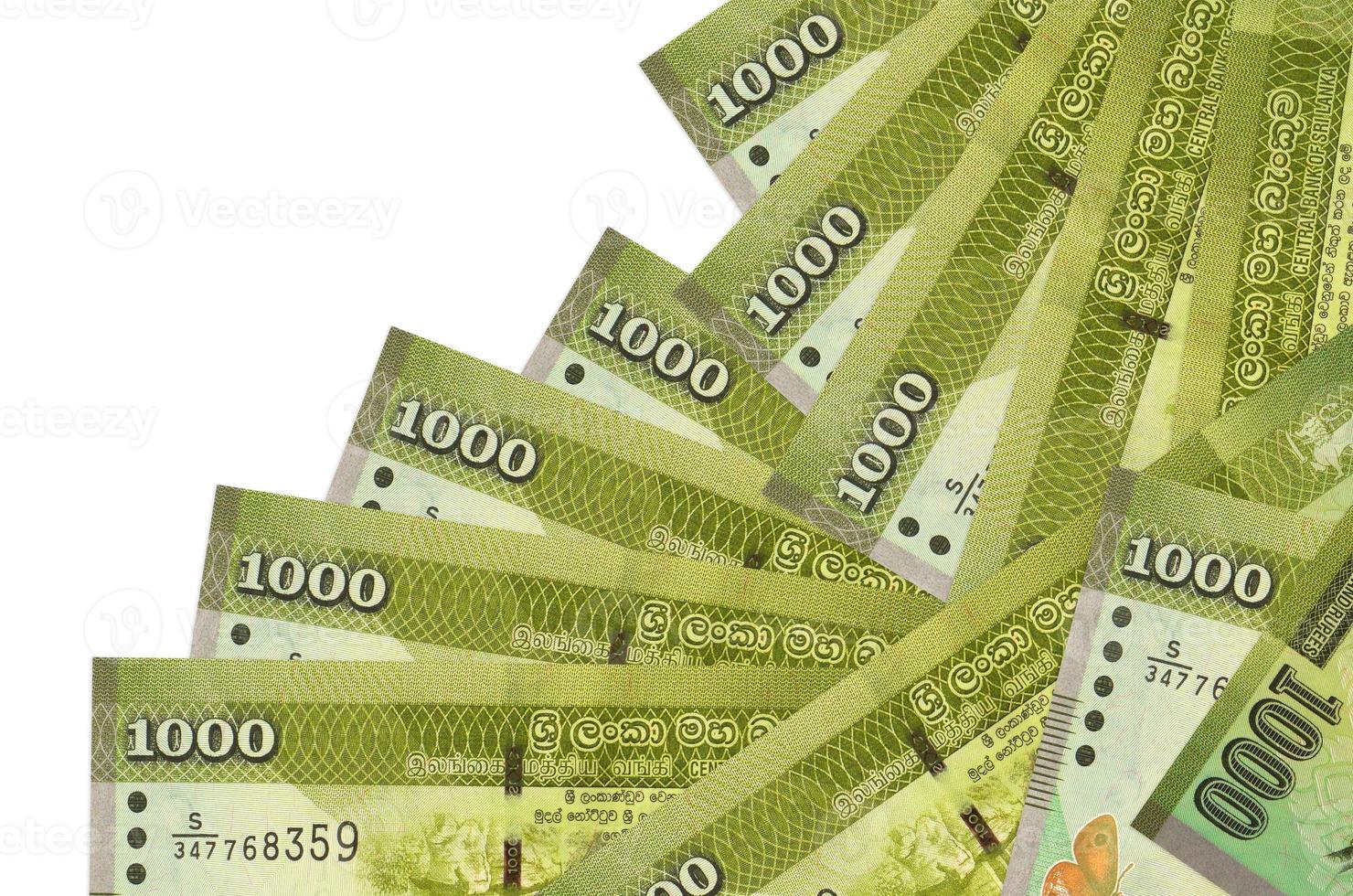 1000 Sri Lankan rupees bills lies in different order isolated on white. Local banking or money making concept photo