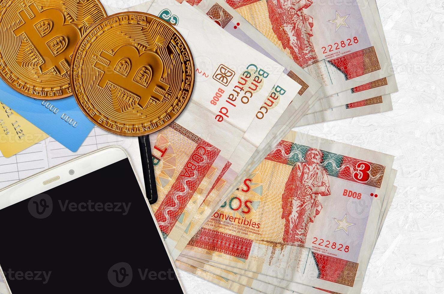 3 cuban pesos convertibles bills and golden bitcoins with smartphone and credit cards. Cryptocurrency investment concept. Crypto mining or trading photo