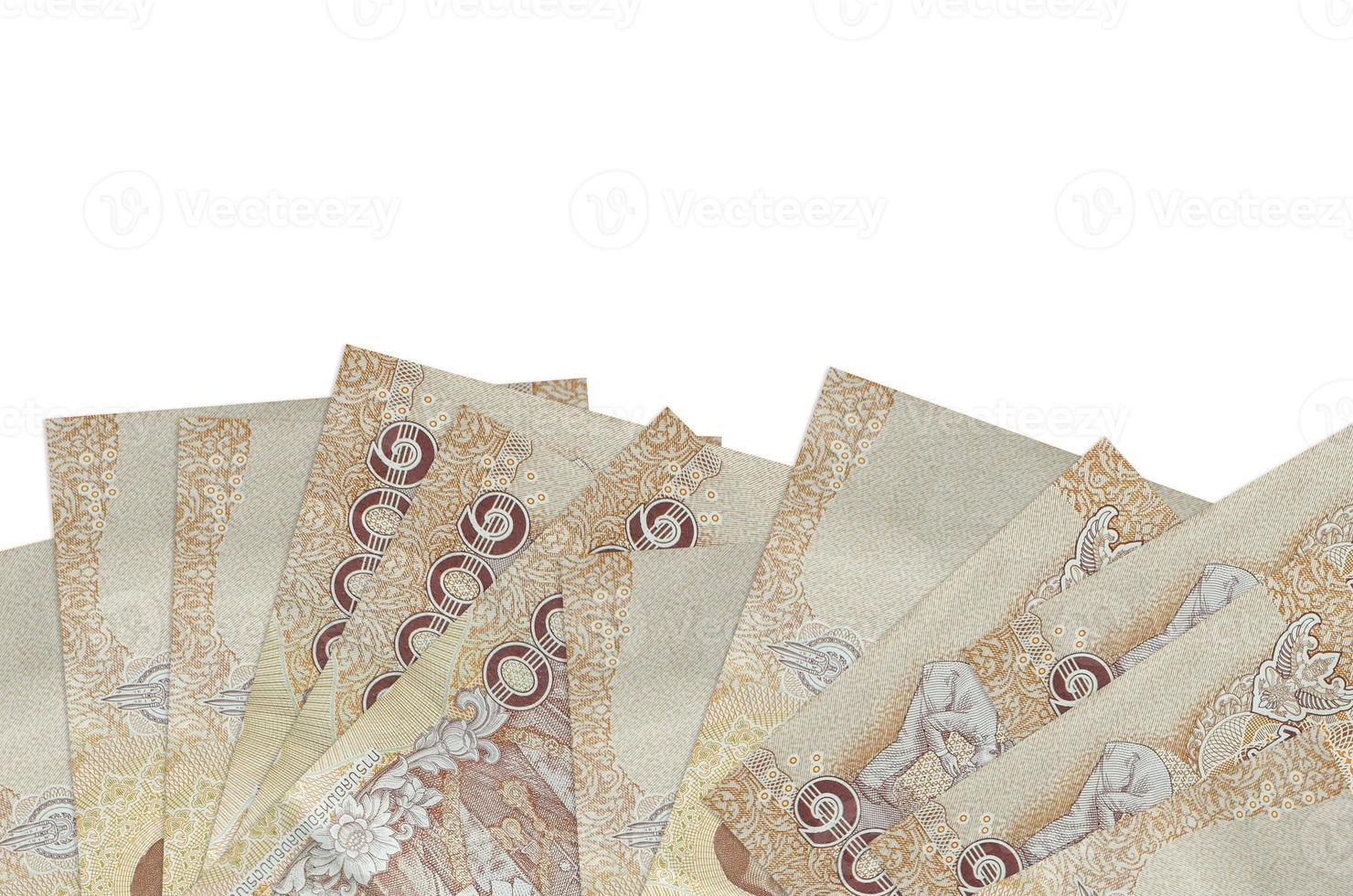 1000 Thai baht bills lies on bottom side of screen isolated on white background with copy space. Background banner template photo