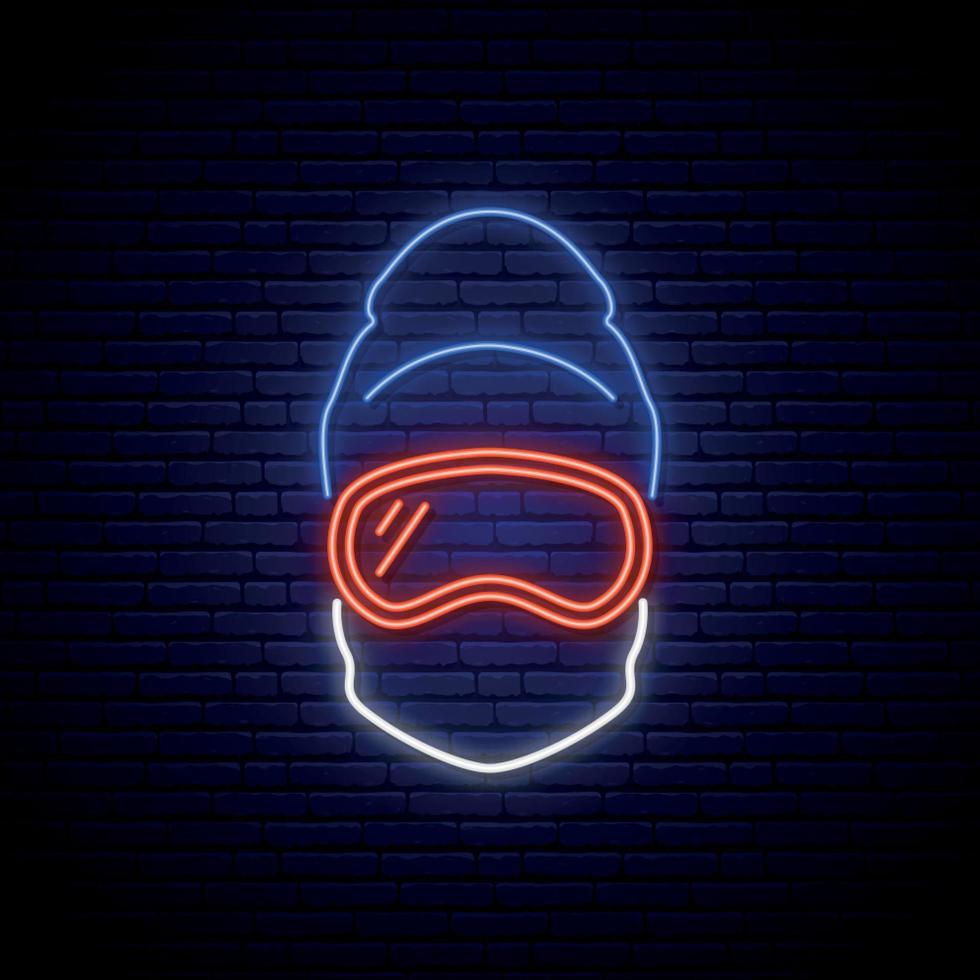 Snowboarder neon sign. Man in ski goggles, mask and winter hat. vector