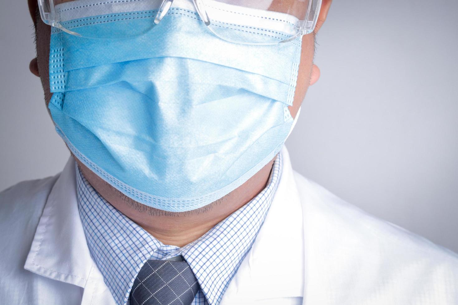 Doctors man  wearing masks blue. Medical care service concept, cure coronavirus. photo