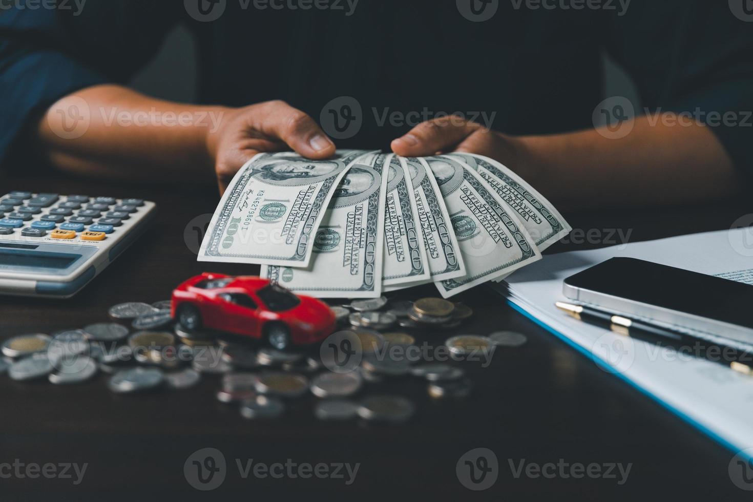 Concept of car insurance business, saving buy - sale with tax and loan for new car. Car toy vehicle with stack coin money on background. Planning to manage transportation finance costs. loan for car photo