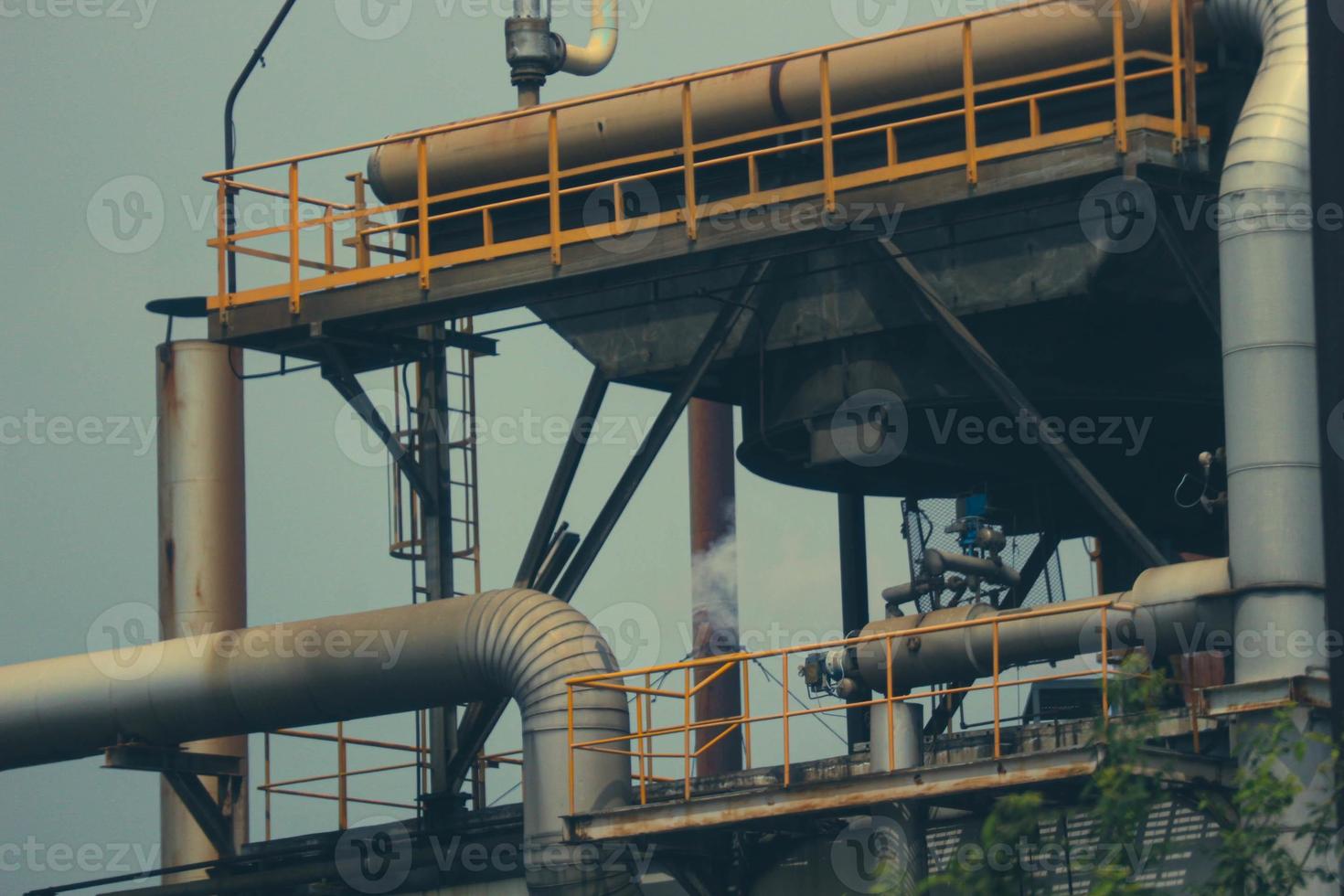 Components of steel pipes from a chemical factory. photo
