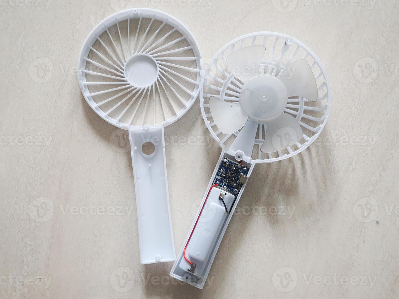 A portable mini fan that was dismantled because it was damaged. photo
