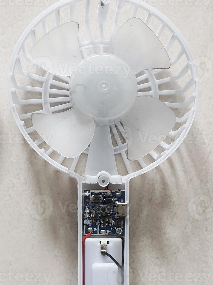 A portable mini fan that was dismantled because it was damaged. photo