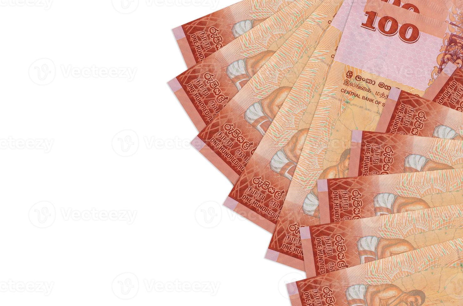 100 Sri Lankan rupees bills lies isolated on white background with copy space. Rich life conceptual background photo