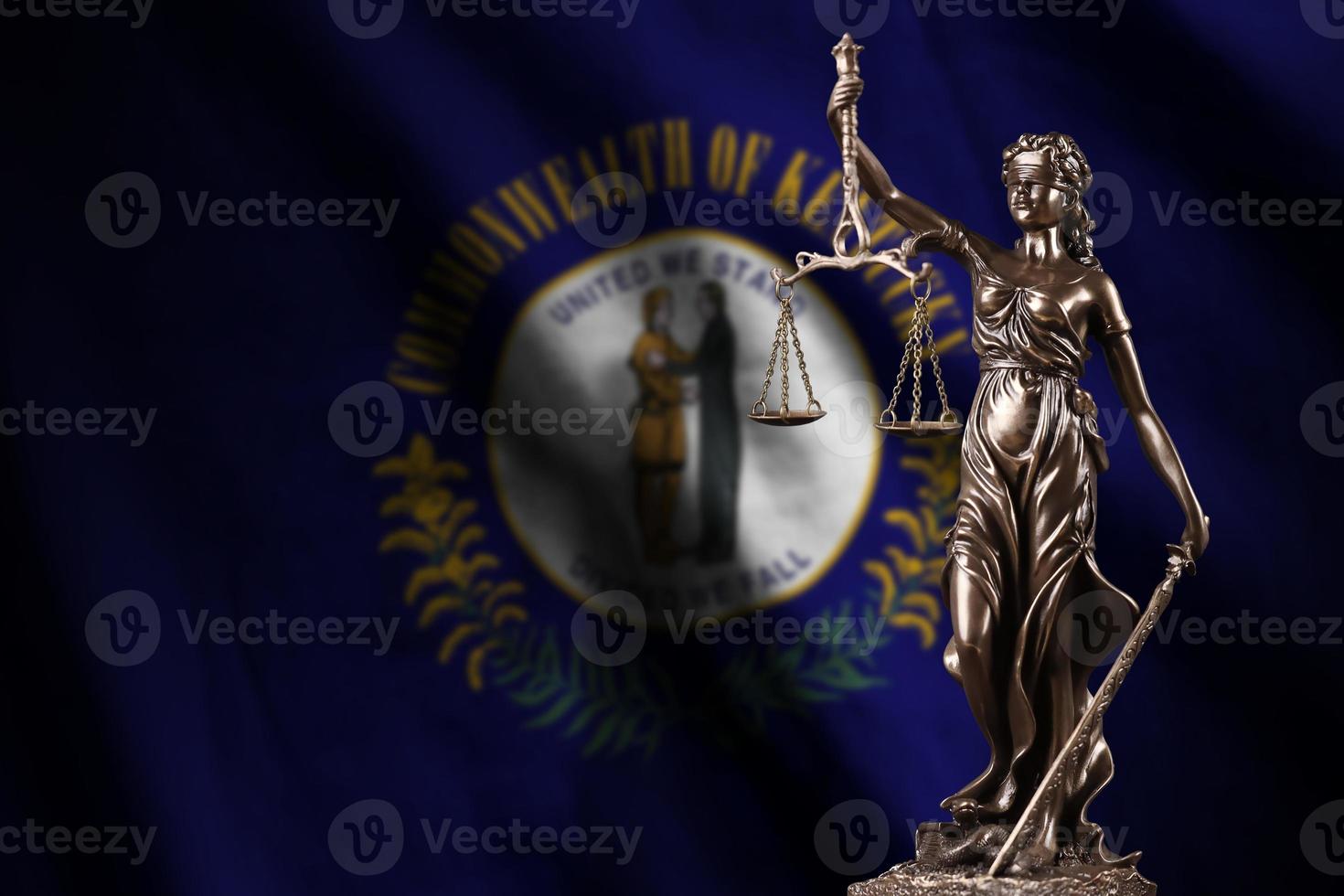 Kentucky US state flag with statue of lady justice and judicial scales in dark room. Concept of judgement and punishment photo