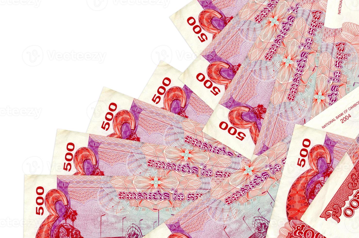 500 Cambodian riels bills lies in different order isolated on white. Local banking or money making concept photo