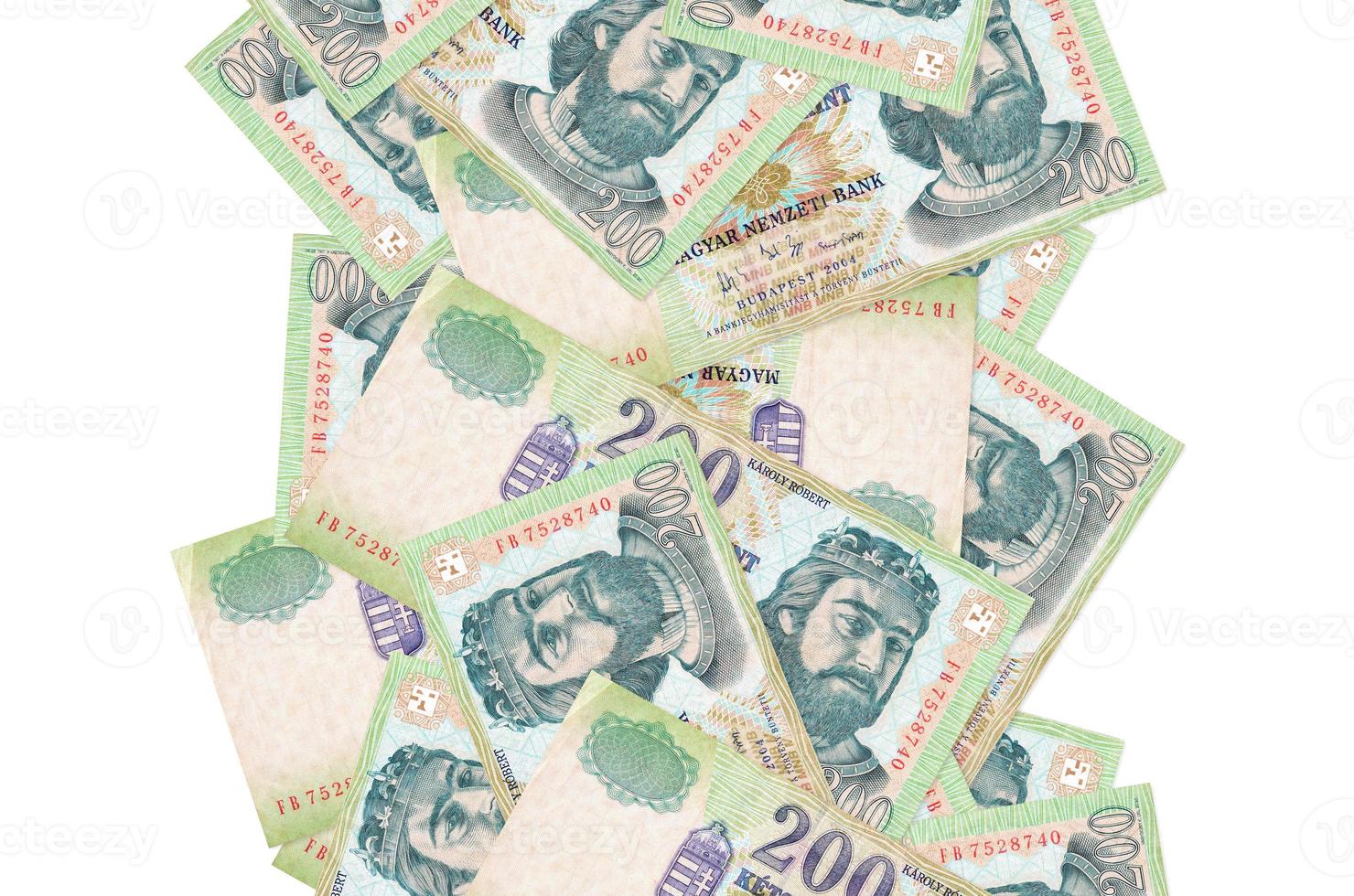 200 Hungarian forint bills flying down isolated on white. Many banknotes falling with white copyspace on left and right side photo