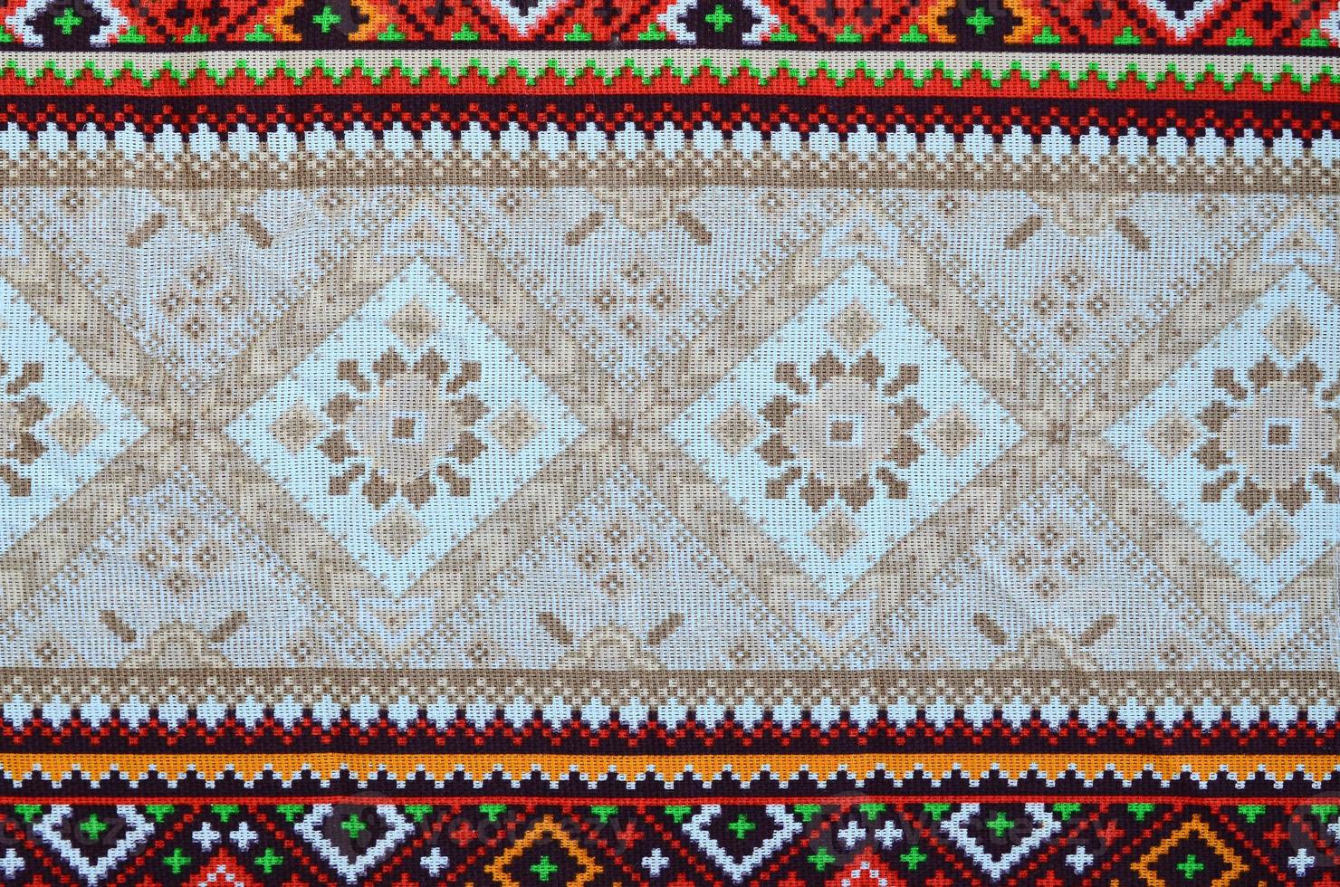 Traditional Ukrainian folk art knitted embroidery pattern on textile fabric photo