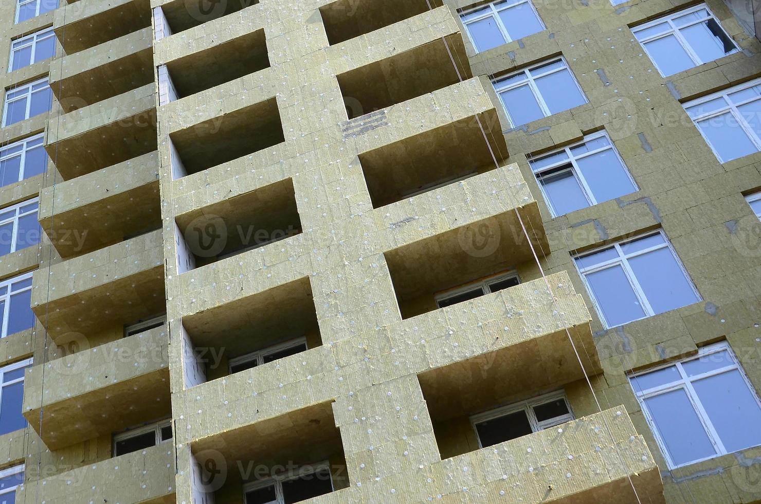 Residential multi store apartement building house facade under construction photo