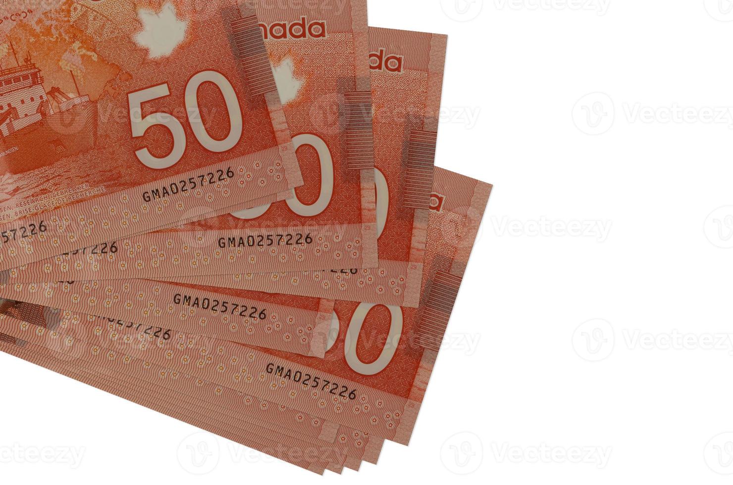 50 Canadian dollars bills lies in small bunch or pack isolated on white. Mockup with copy space. Business and currency exchange photo
