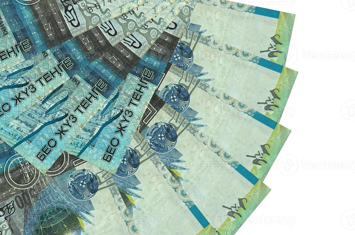 500 Kazakhstani tenge bills lies isolated on white background with copy space stacked in fan shape close up photo