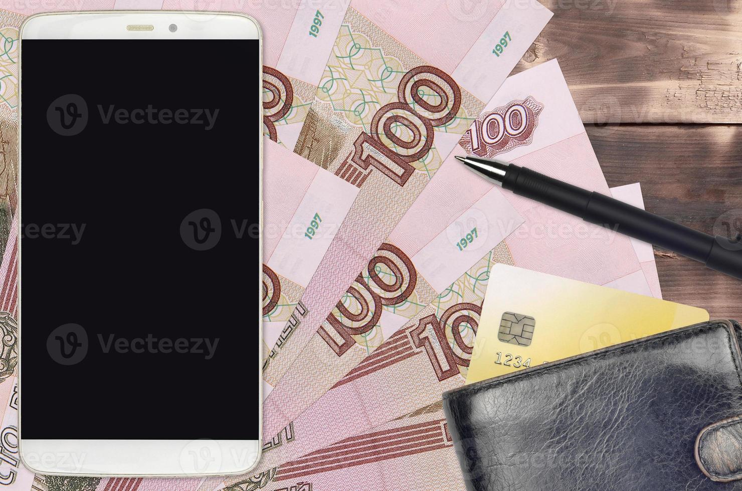 100 russian rubles bills and smartphone with purse and credit card. E-payments or e-commerce concept. Online shopping and business with portable devices photo