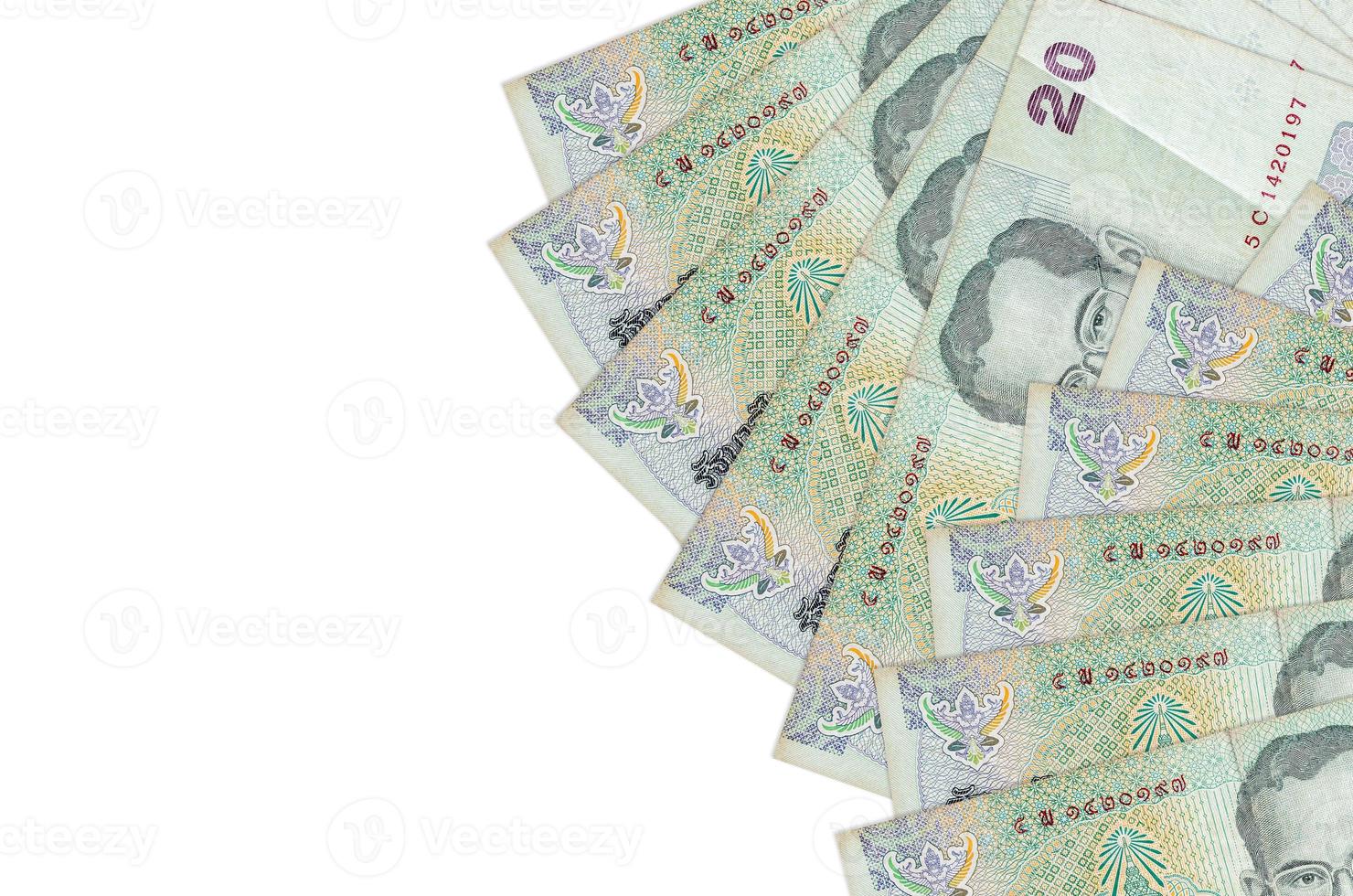 Los billetes de 20 baht tailandeses se encuentran aislados en fondo blanco con espacio de copia. fondo conceptual de vida rica foto