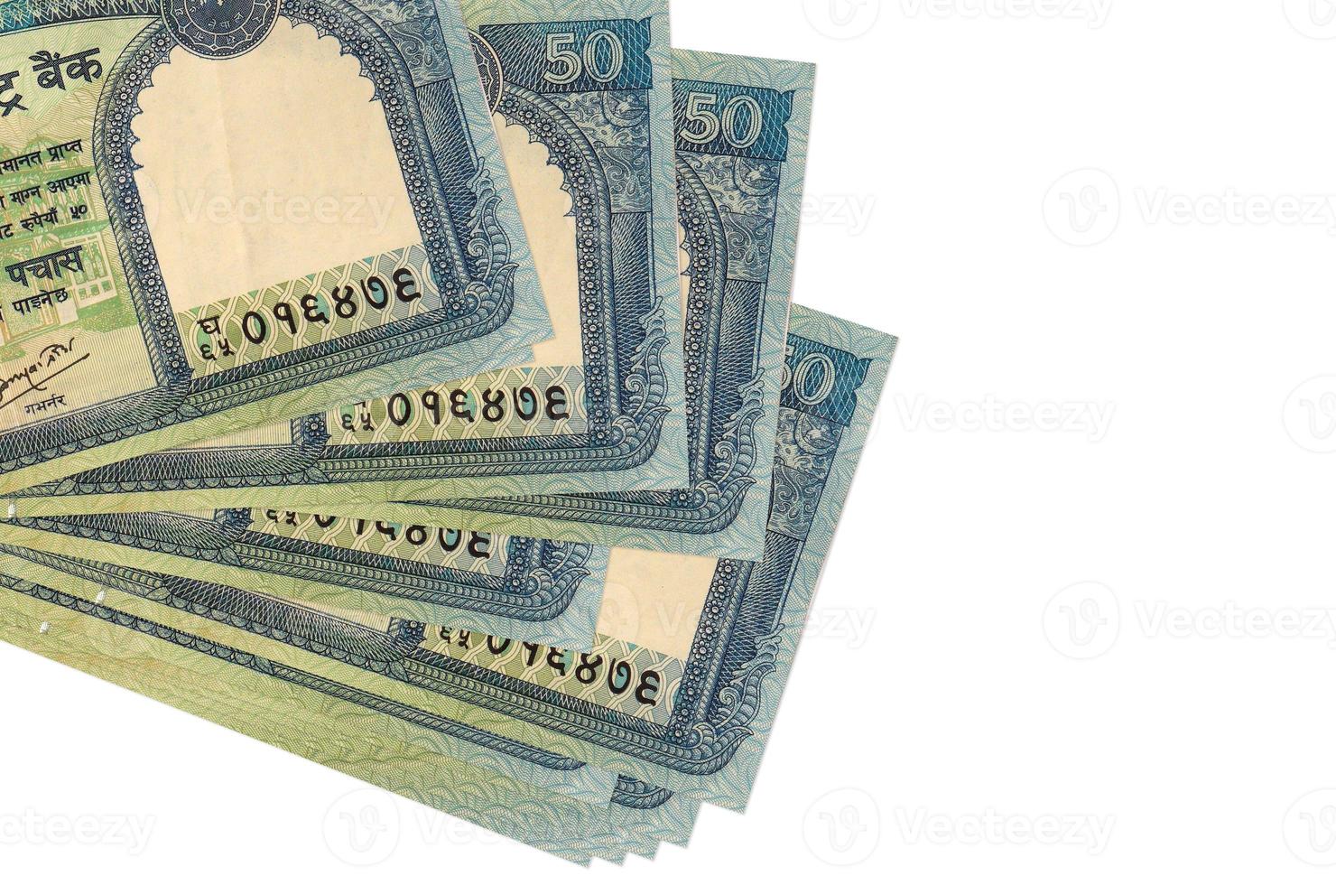 50 Nepalese rupees bills lies in small bunch or pack isolated on white. Mockup with copy space. Business and currency exchange photo
